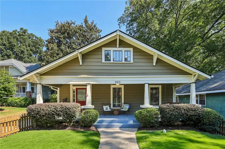 Craftsman-style exterior with a covered front porch, prominent gable, and horizontal siding