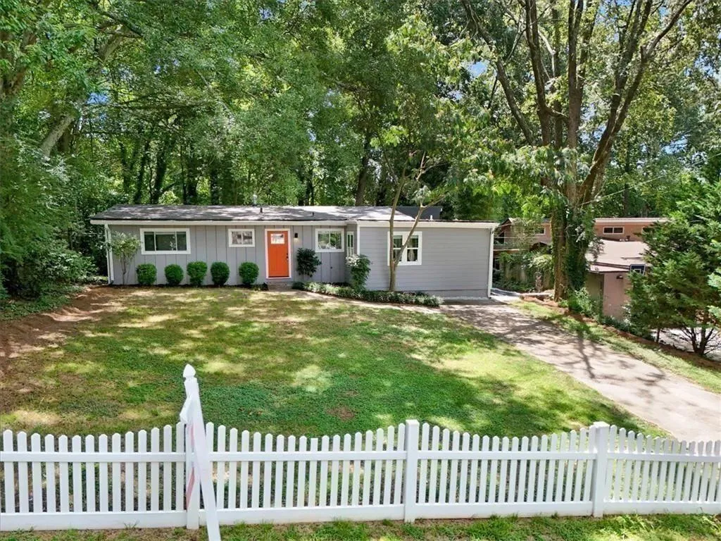 Flat grassy front yard perfect for pets and play