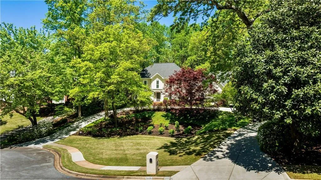 Newer concrete horseshoe driveway with ample parking