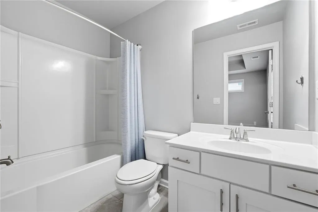 Full bathroom featuring vanity and shower / tub combo