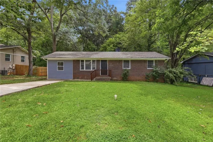 Brick and siding exterior with a covered entry