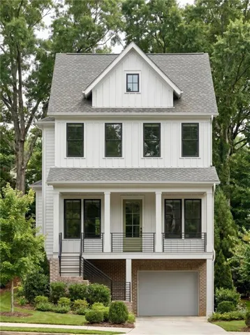 Modern farmhouse-style residence featuring white board-and-batten siding
