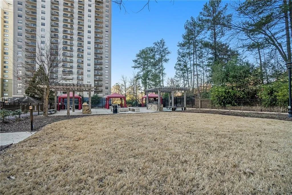 View of property's community featuring a gazebo and a lawn