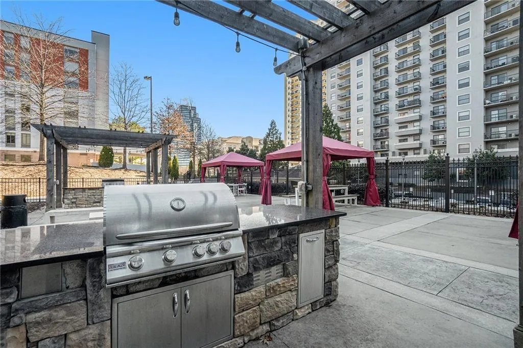 View of patio with a pergola, a grill, and a gazebo