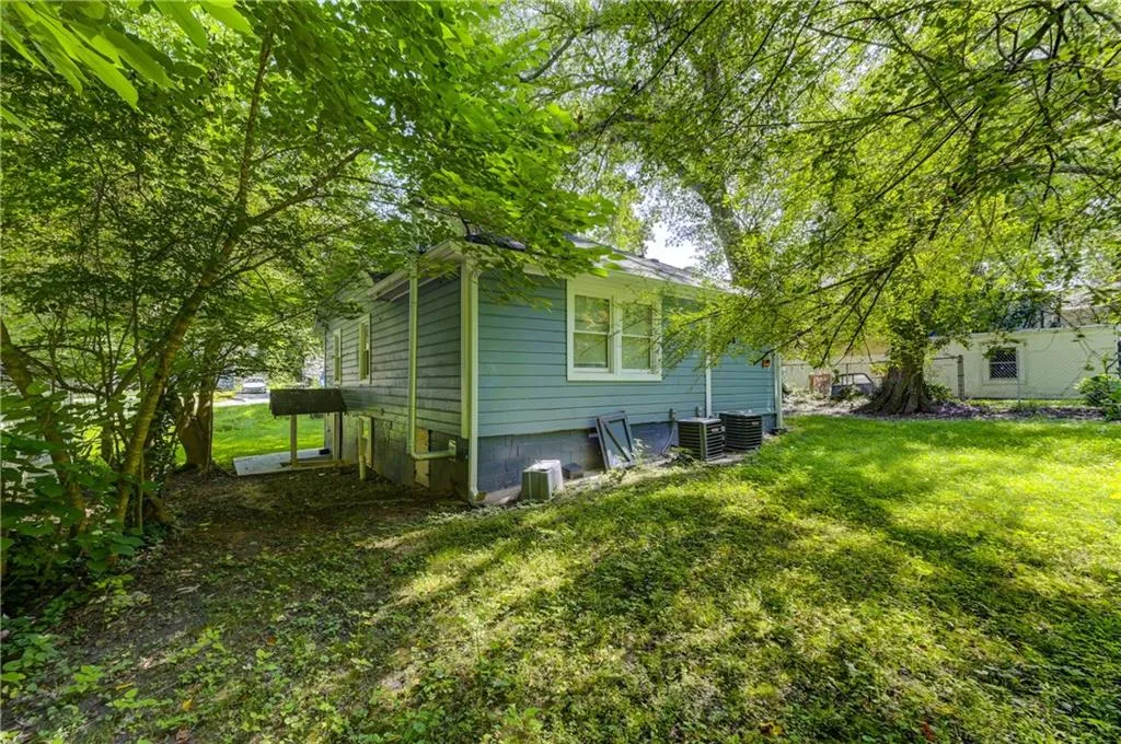 View of home's exterior with a yard