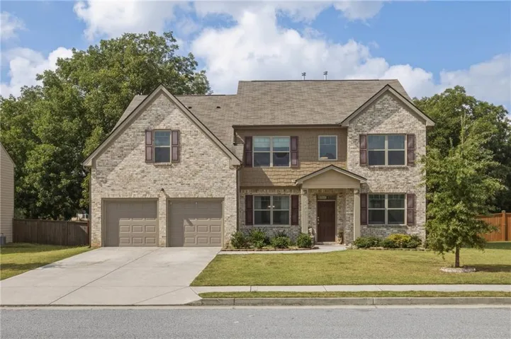 Brick and shingle exterior with a gabled roof
