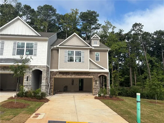 Stone and siding exterior with gabled roof lines