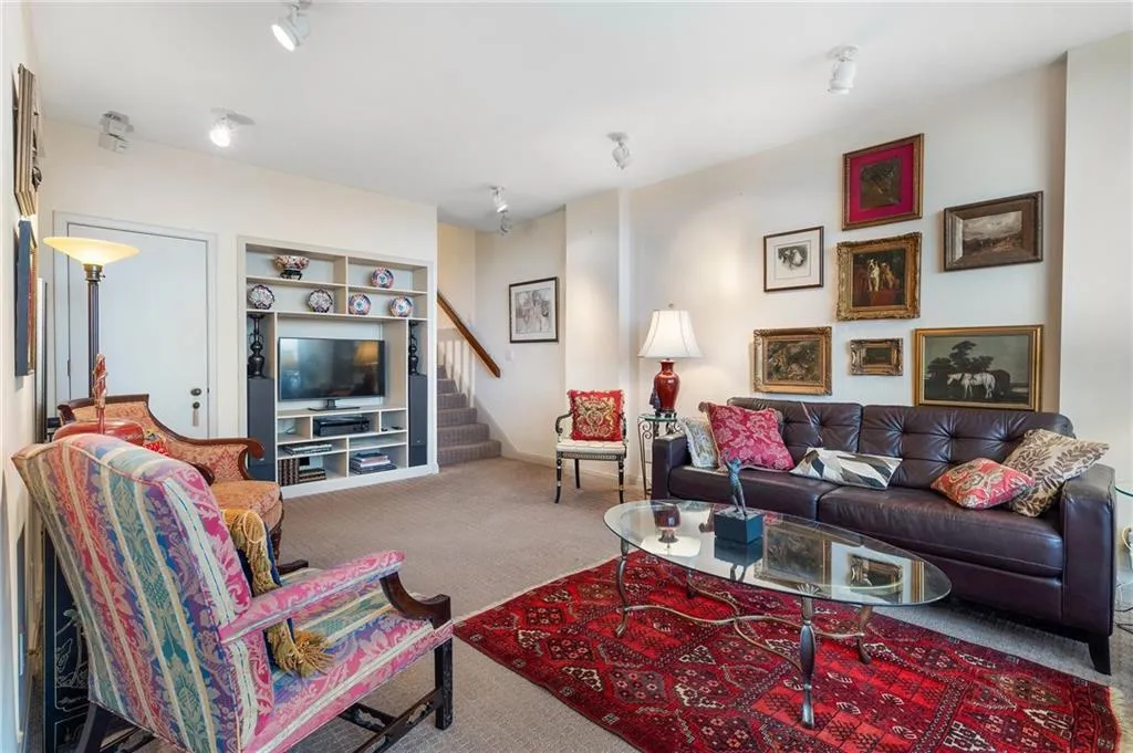 Living room with carpet floors and stairs