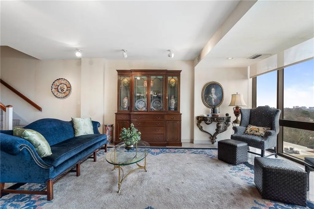 Living area with visible vents and stairs