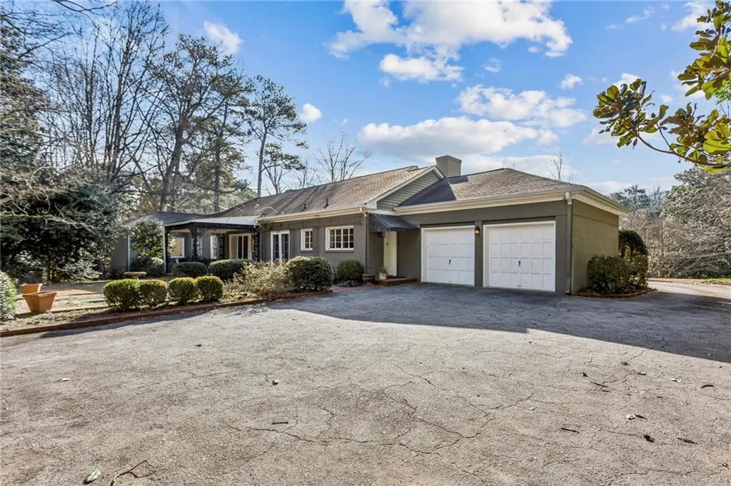Back of house with two-car garage