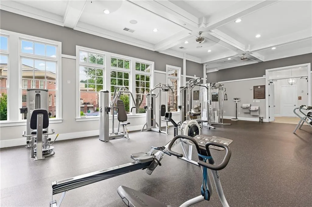 Fitness center featuring commercial-grade equipment, located in community clubhouse.
