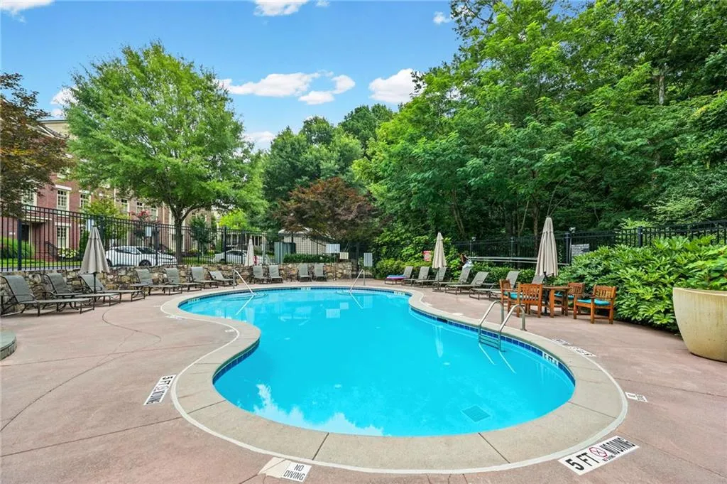 Resort-style pool area with direct access to the multi-story community clubhouse. Daylight View