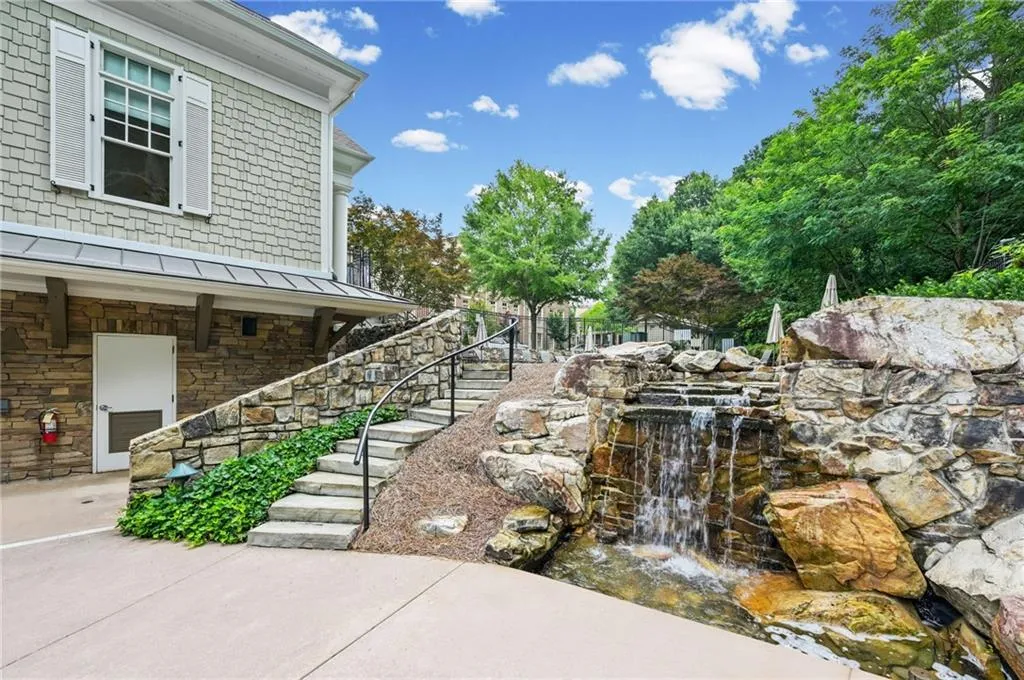 Beautiful waterfall adorning stairs to multi-level community clubhouse