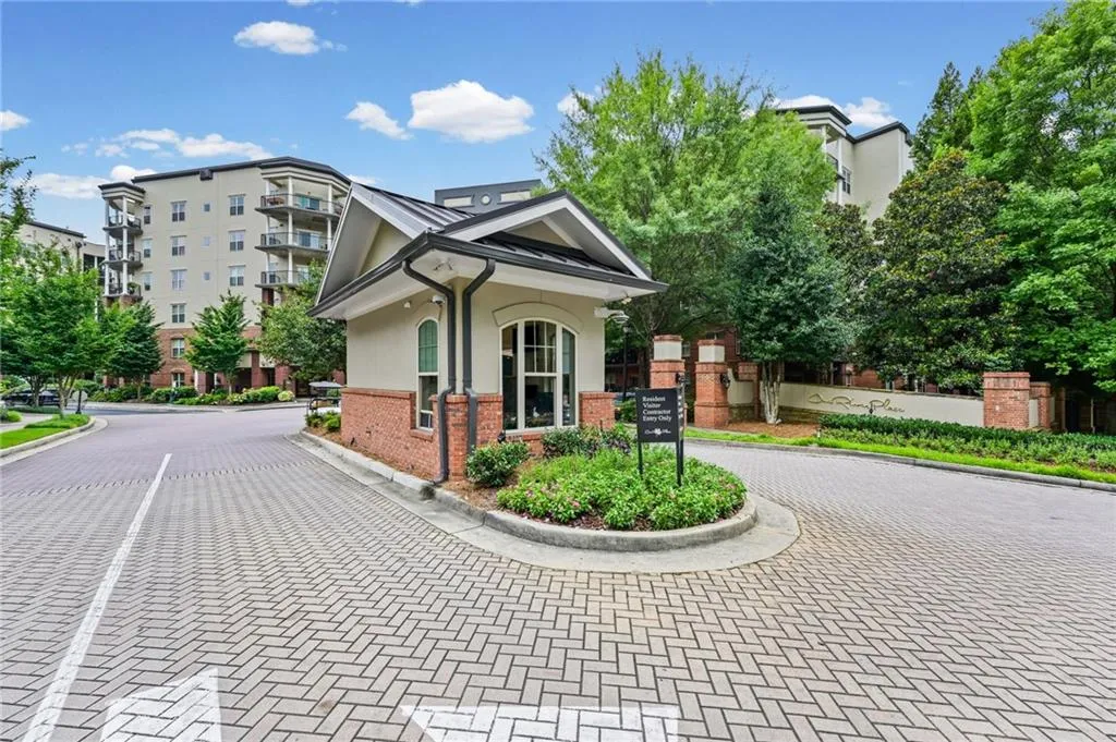 Manned gated entrance to One River Place.