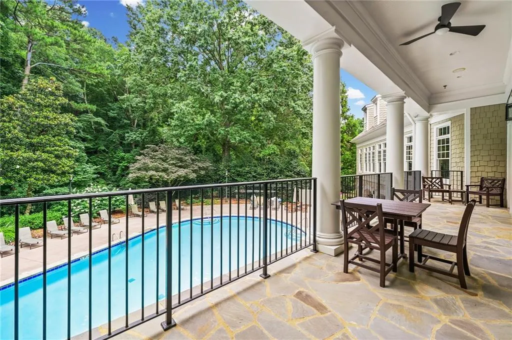 Resort-style pool area with direct access to the multi-story community clubhouse. Daylight View