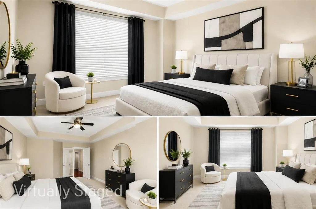 Large primary bedroom with neutral wall tones and neutral colored carpet, adjacent to custom closet system and bathroom.-Daylight View