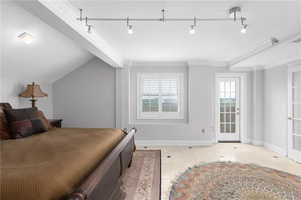Recessed window featuring white louvered shutters