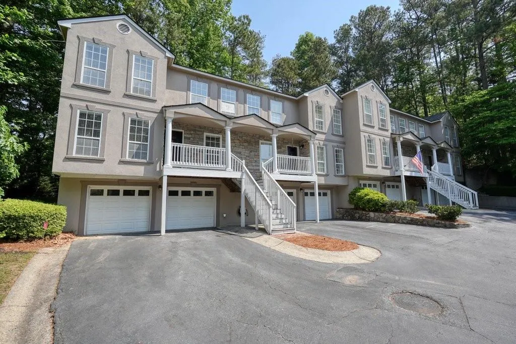 View of property with a garage