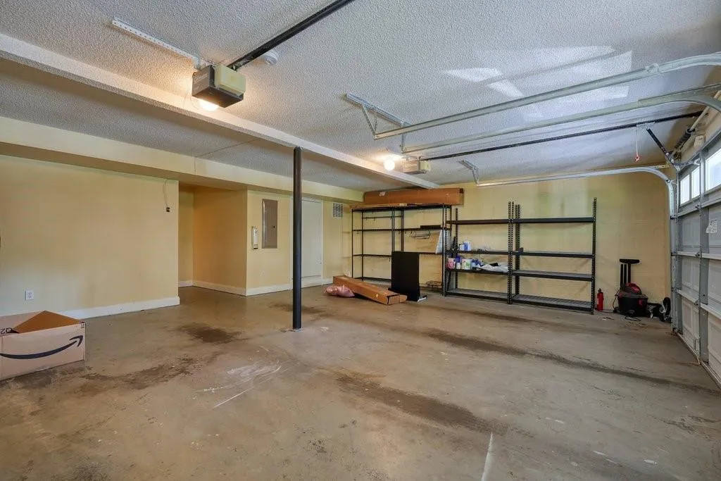 Garage featuring a garage door opener