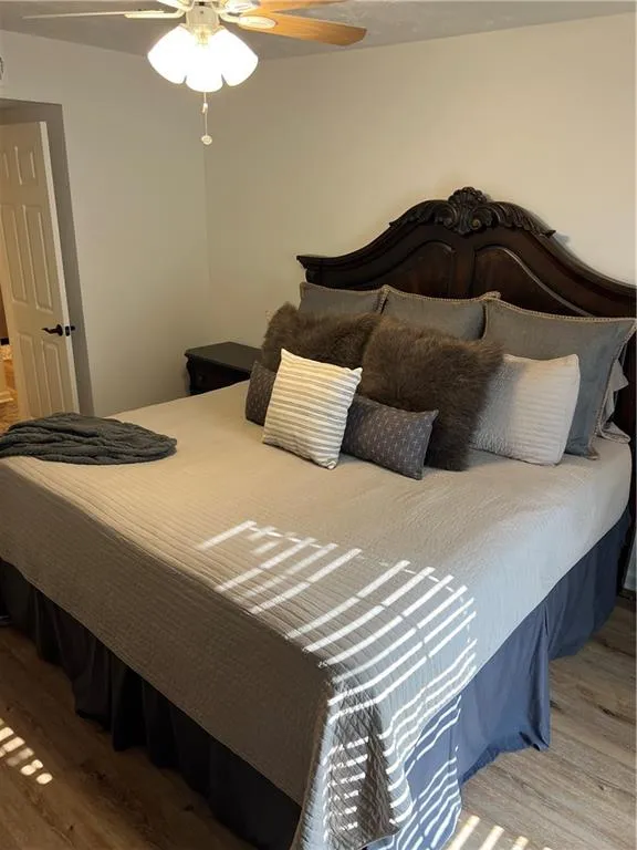 Bedroom featuring light wood finished floors and ceiling fan
