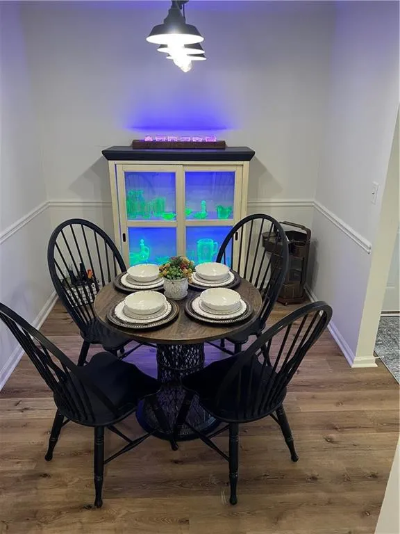 Dining space with wood finished floors