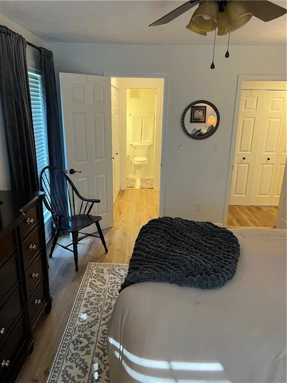 Bedroom featuring light wood finished floors and ceiling fan