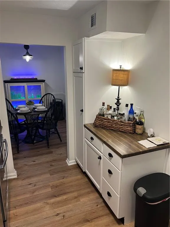 Hallway featuring light wood-style flooring