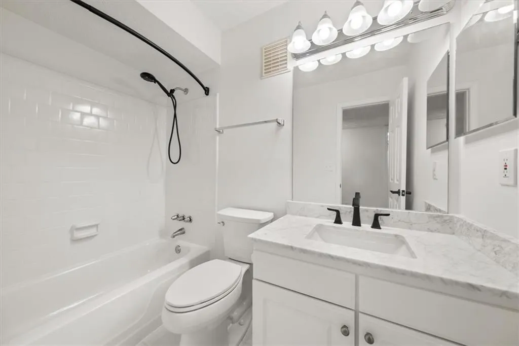 Full bathroom featuring shower / washtub combination and vanity