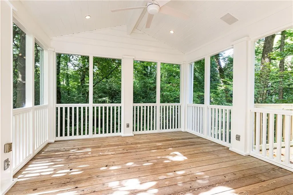 Freshly screened in porch with year-round canopy views.