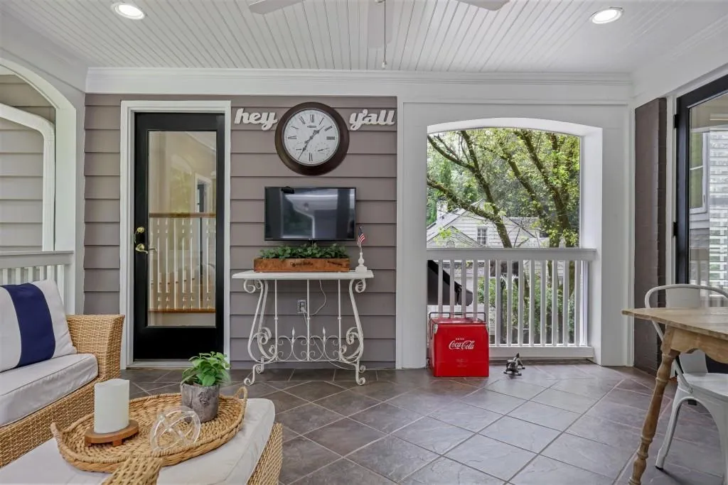 Screened porch off kitchen connects to Carriage house