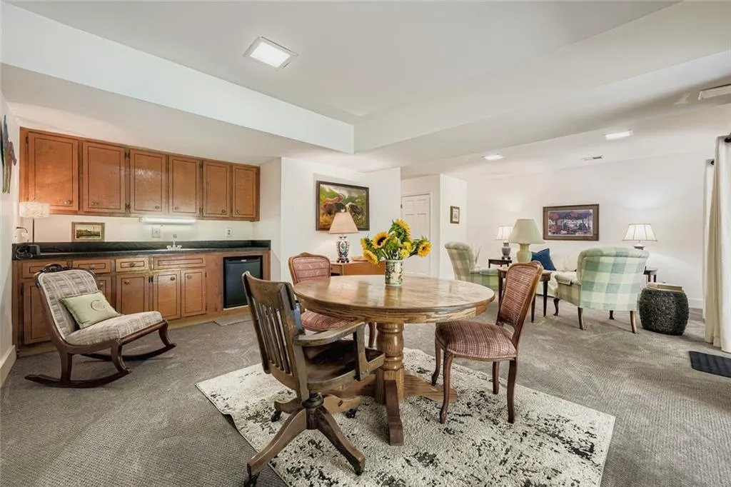 Dining space featuring light colored carpet