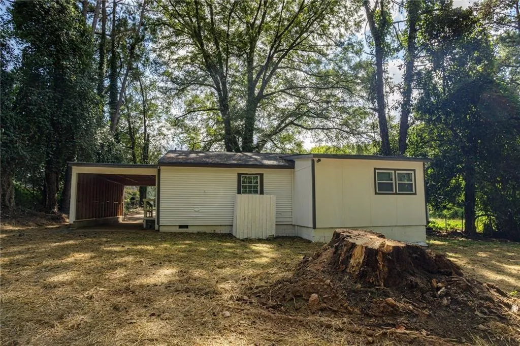 View of outbuilding with a carport