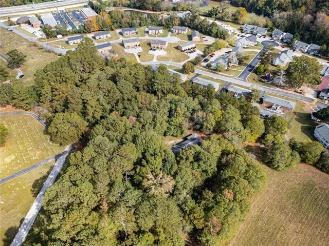 Expansive undeveloped parcel with significant tree coverage