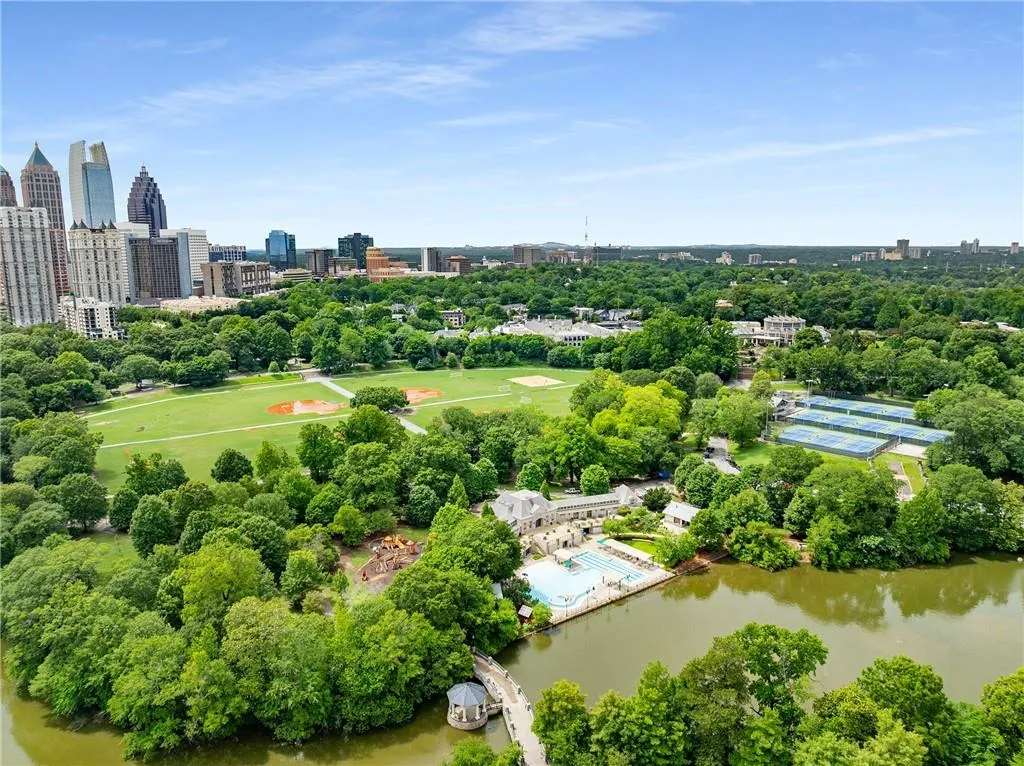 Drone / aerial view of city skyline and a tree filled landscape