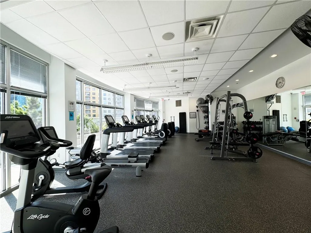 Workout area with a paneled ceiling