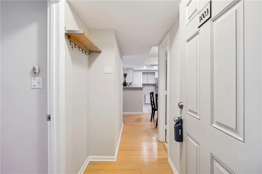 Hallway featuring light wood-type flooring