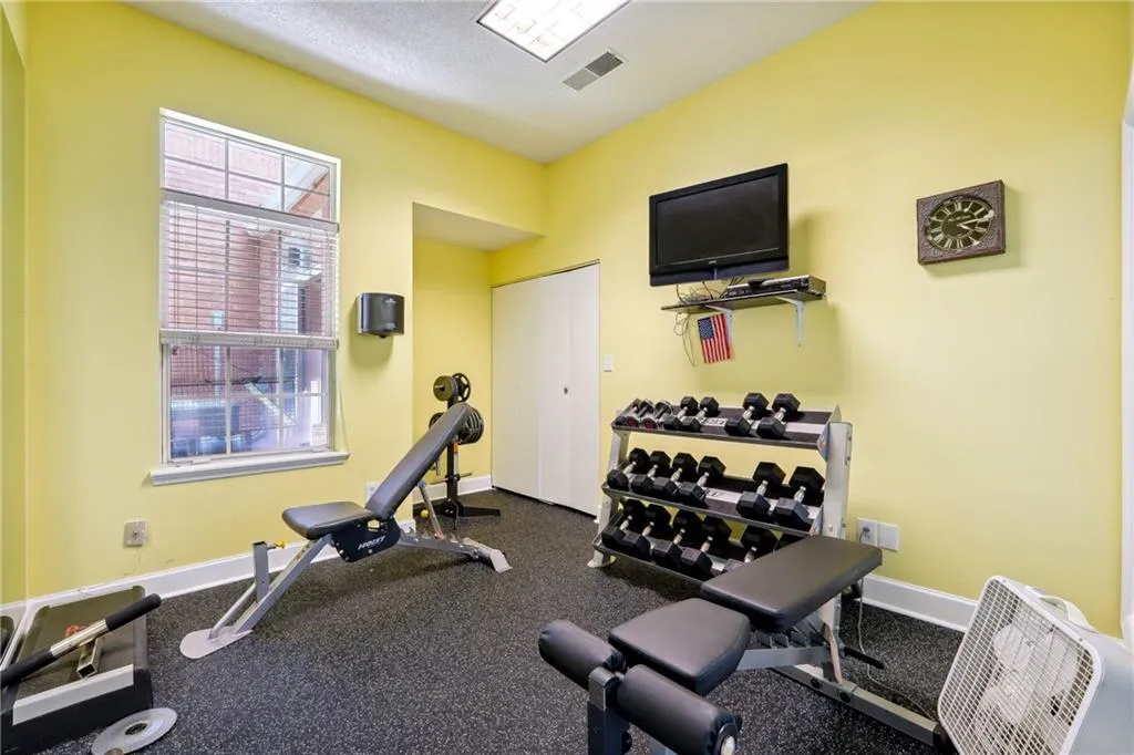 Workout area featuring carpet flooring