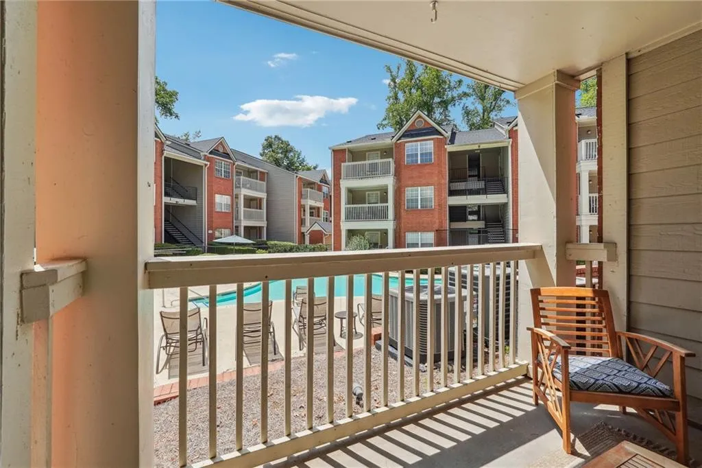 overlook the pool from your private balcony