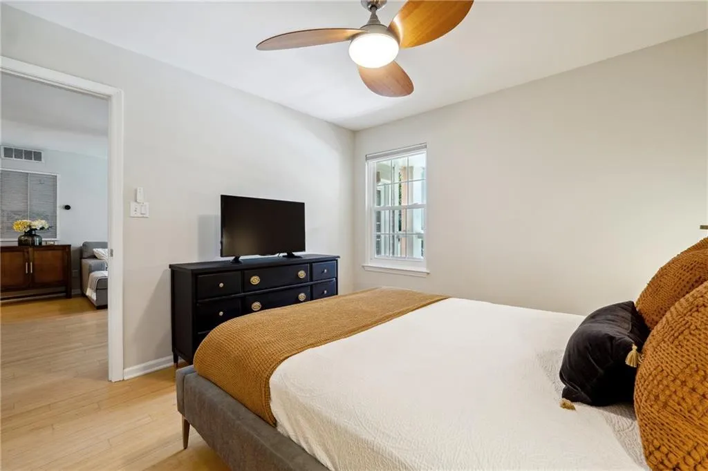 Bedroom featuring light wood-type flooring and ceiling fan