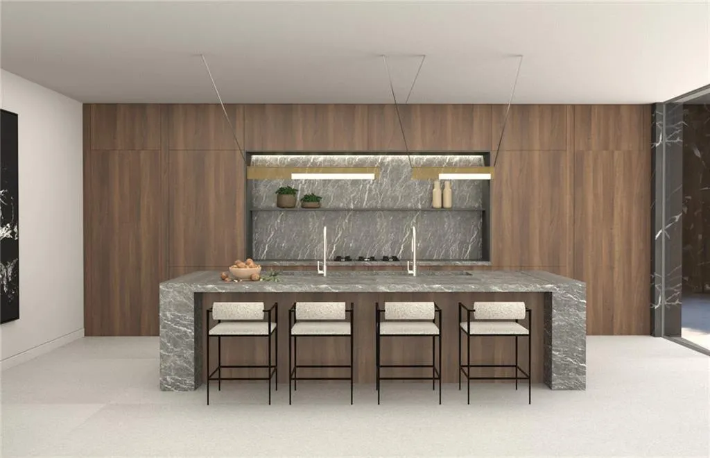 Gourmet kitchen featuring a waterfall island with integrated seating, stone countertops, wood-finish cabinetry, and built-in shelving with accent lighting