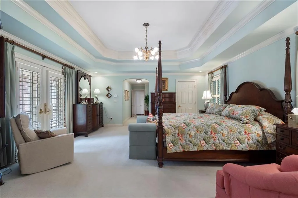 This is the view into the hallway leading to the bedroom and French doors leading to the courtyard.