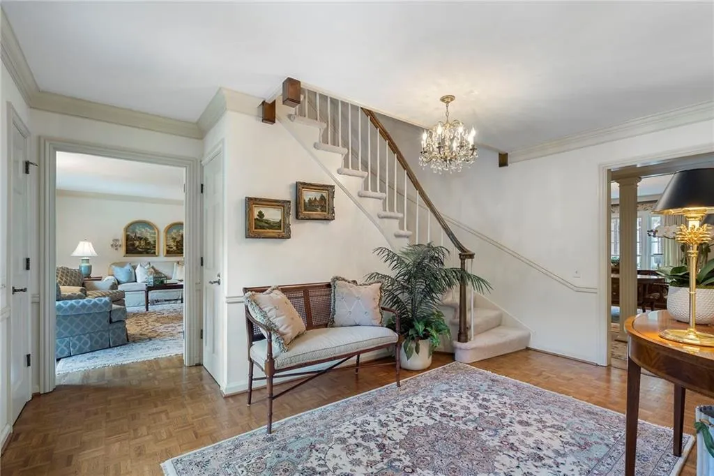 Picture of the front door and looking into the large light filled living room
