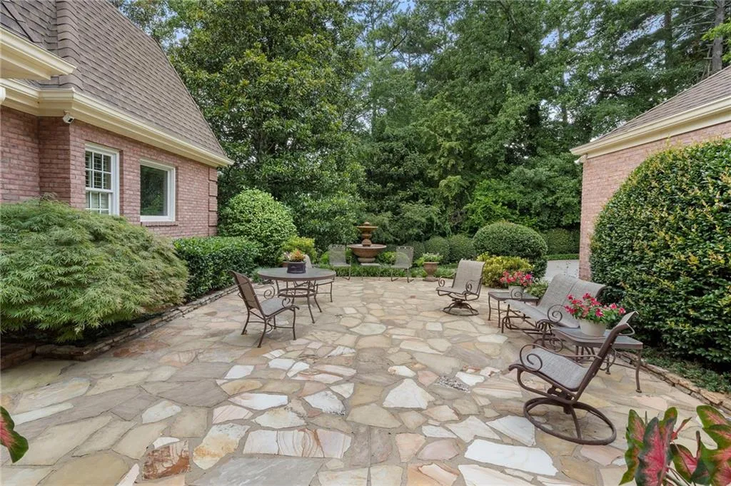 The entire main level is built around this stunning flagstone courtyard.  The fountain and it's sound make it perfect for gatherings or just having coffee in the morning.
