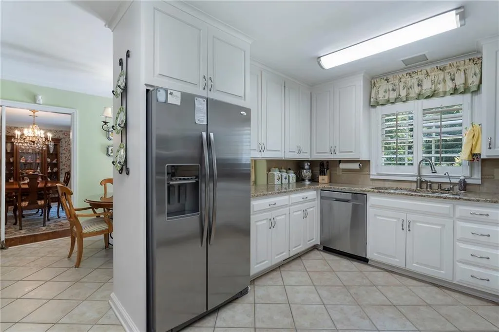 This kitchen has tremendous potential for a huge island and knocking out the wall to open up into the great room.  It is also in beautiful move in condition for renovation later.