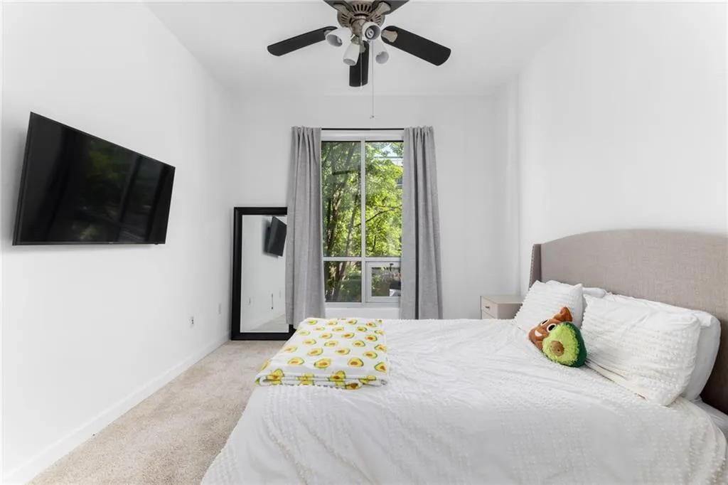 Bedroom featuring carpet floors and ceiling fan