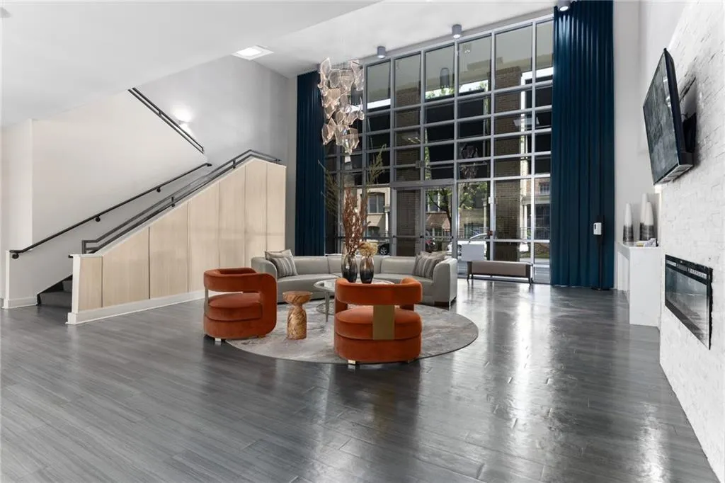 Building lobby featuring a towering ceiling and stairway