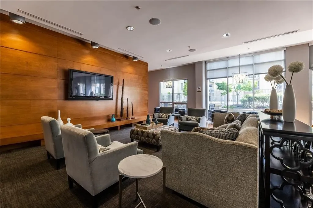 Community lobby featuring recessed lighting and wooden walls