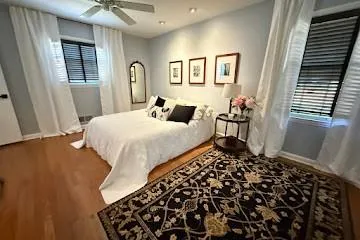 Bedroom featuring ceiling fan, foak floors, and recessed lighting