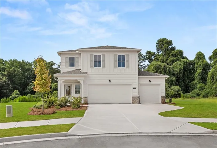 Modern two-story residence with white siding and gray shutters