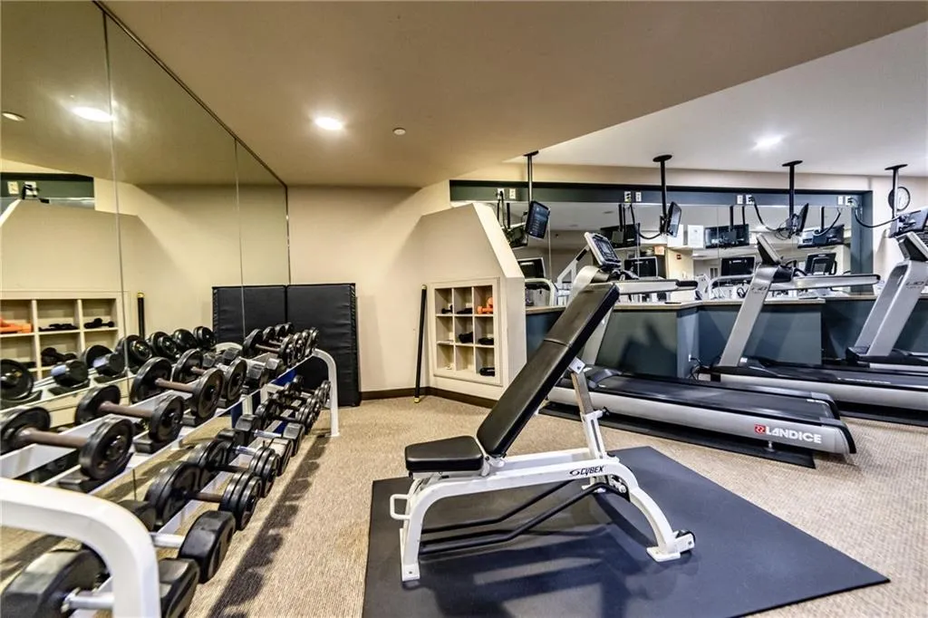 Workout area featuring carpet and recessed lighting